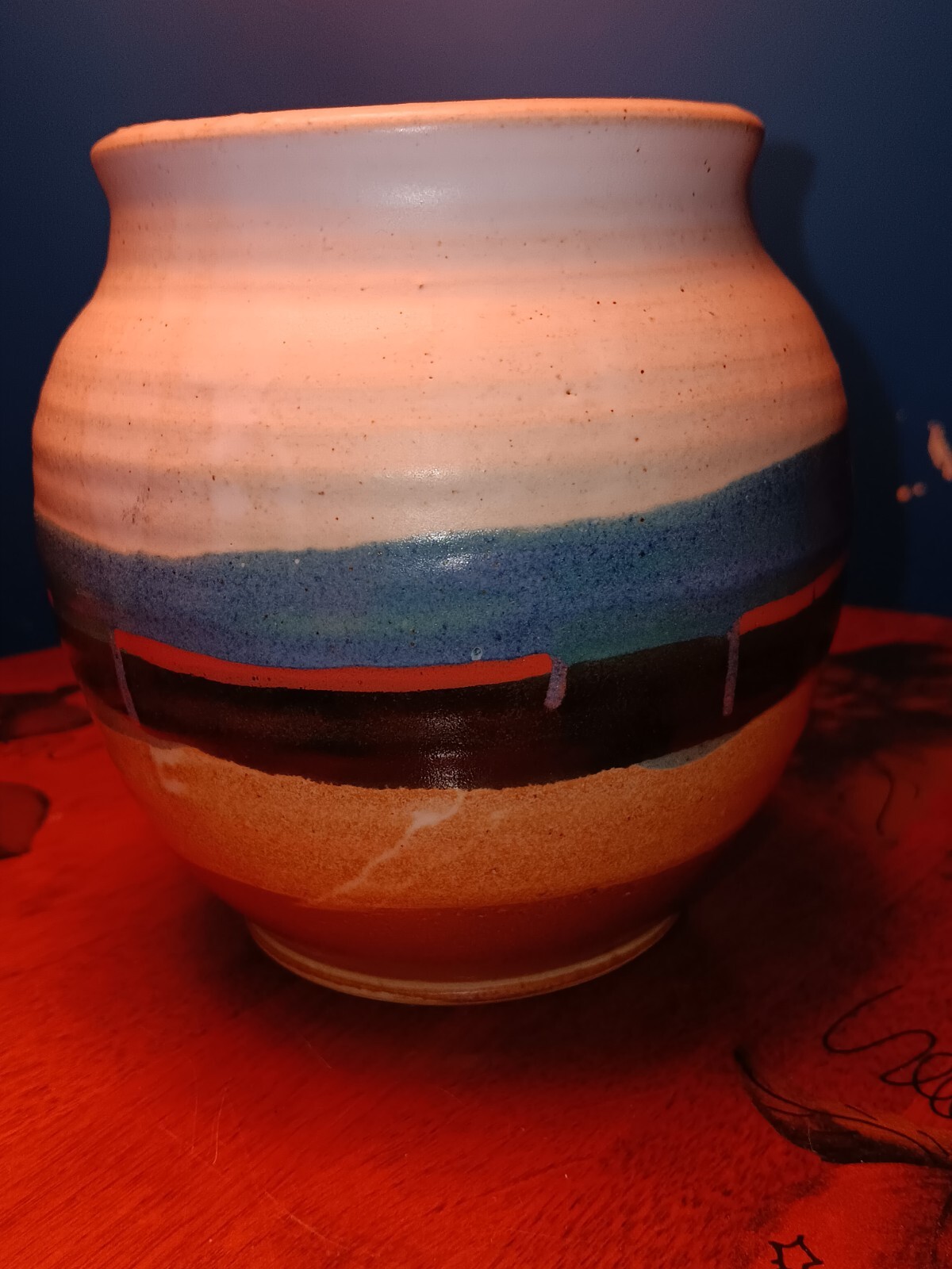 Pottery Artist Signed Blue. White blue red black tan brown, Round the vase.