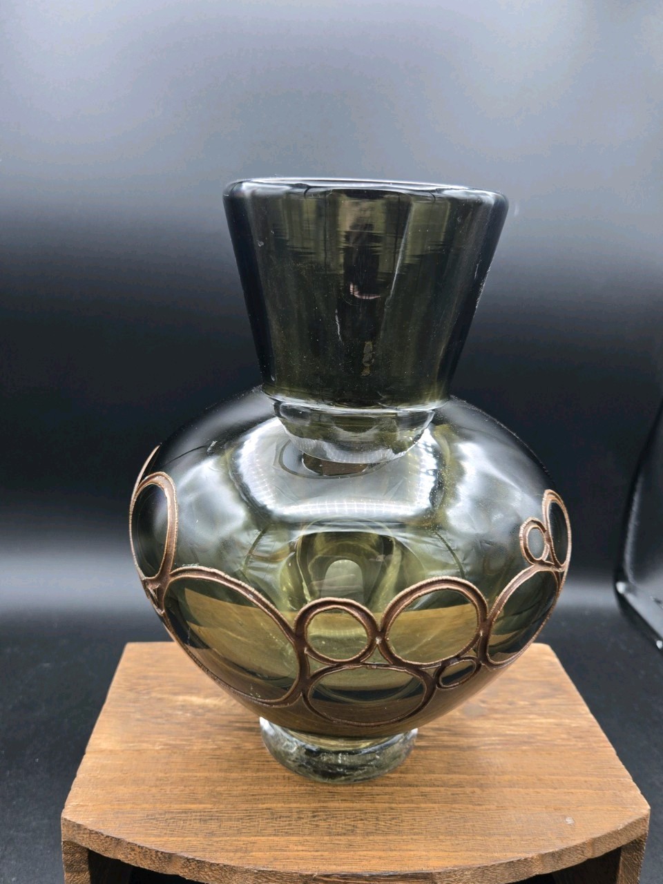 A Beautiful Green Art Glass Vase with Copper Electroform circle design.