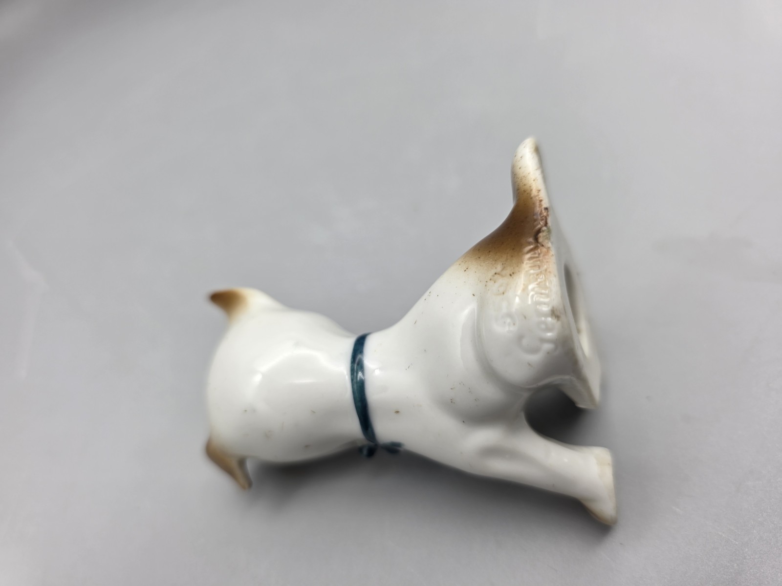 Vintage Porcelain Puppy Dog Figurine W Fly on Nose Brown Speckled Germany #5562