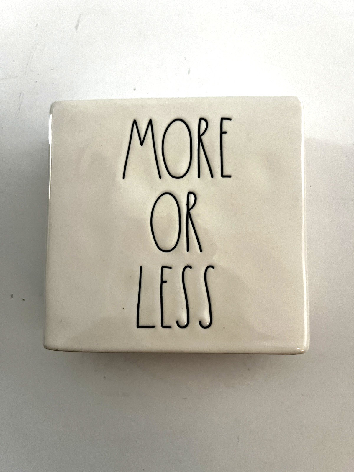 Rae Dunn Home Decor “MORE OR LESS” White Artisan Collection By Magenta 4″ Square