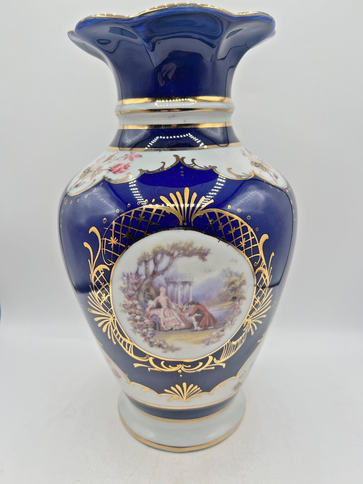 Fine Egyption porcelain vase with cobalt blue,gold,gilt, and pastoral scenes
