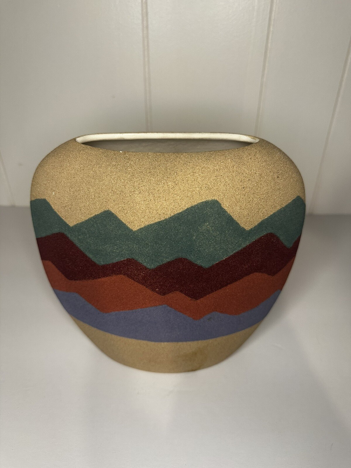 Two southwestern sand vases on large and one medium size
