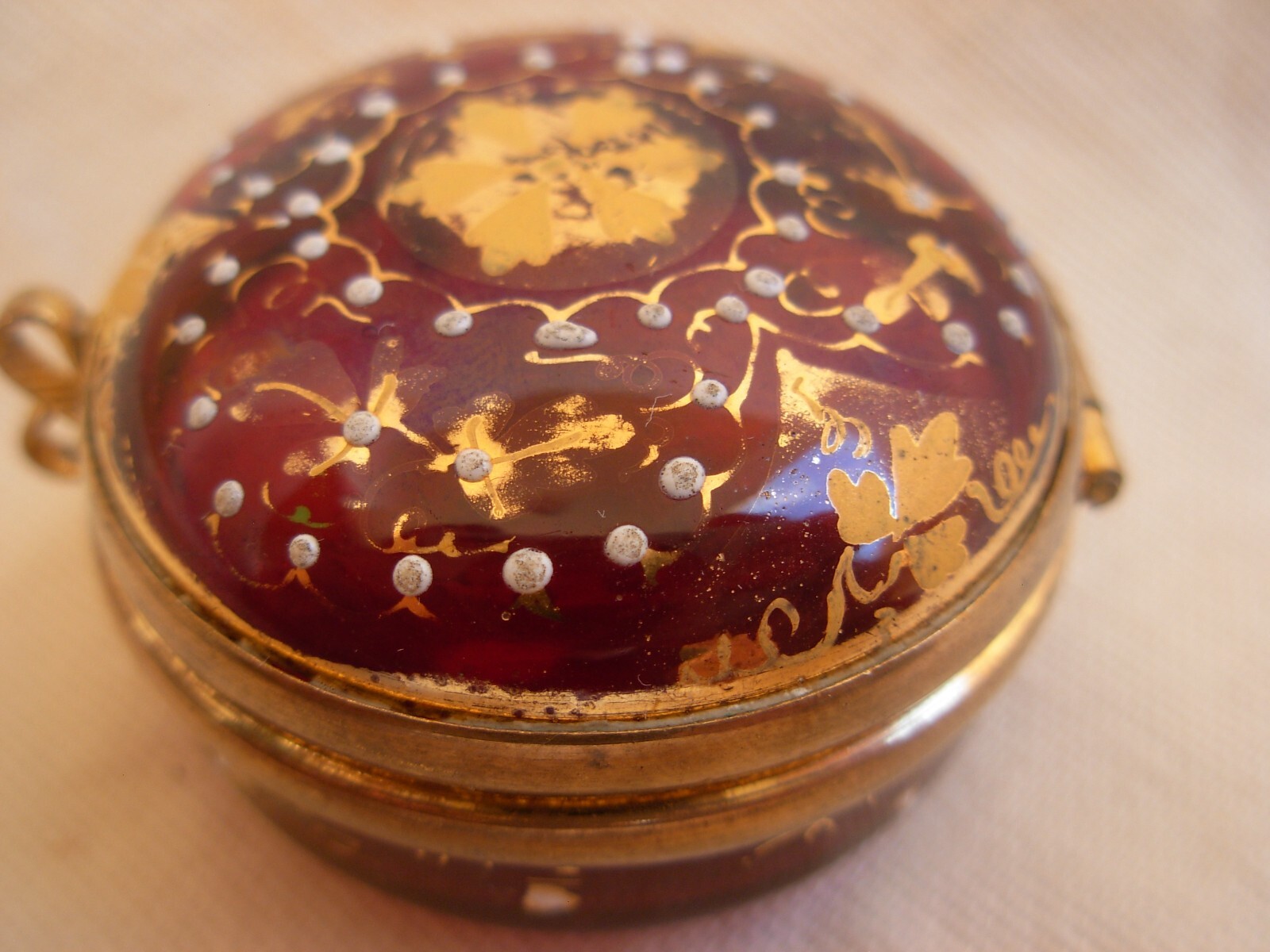 ANTIQUE BOHEMIAN ENAMELED RED GLASS PILL BOX WITH GILT BRASS MOUNT,LATE 19th.