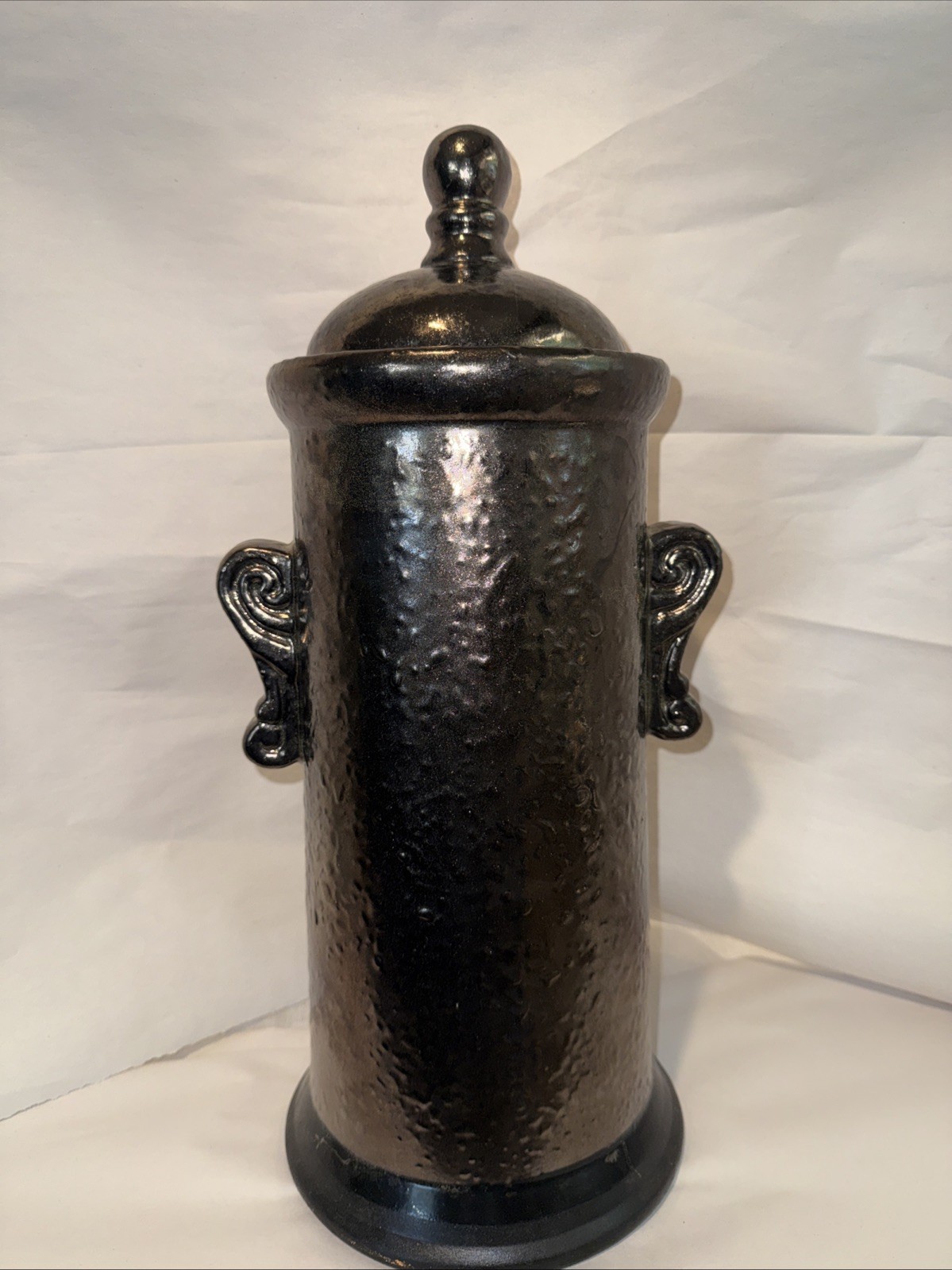 A dark glazed studio pottery urn-like vessel with lid and handles 16.5” Tall