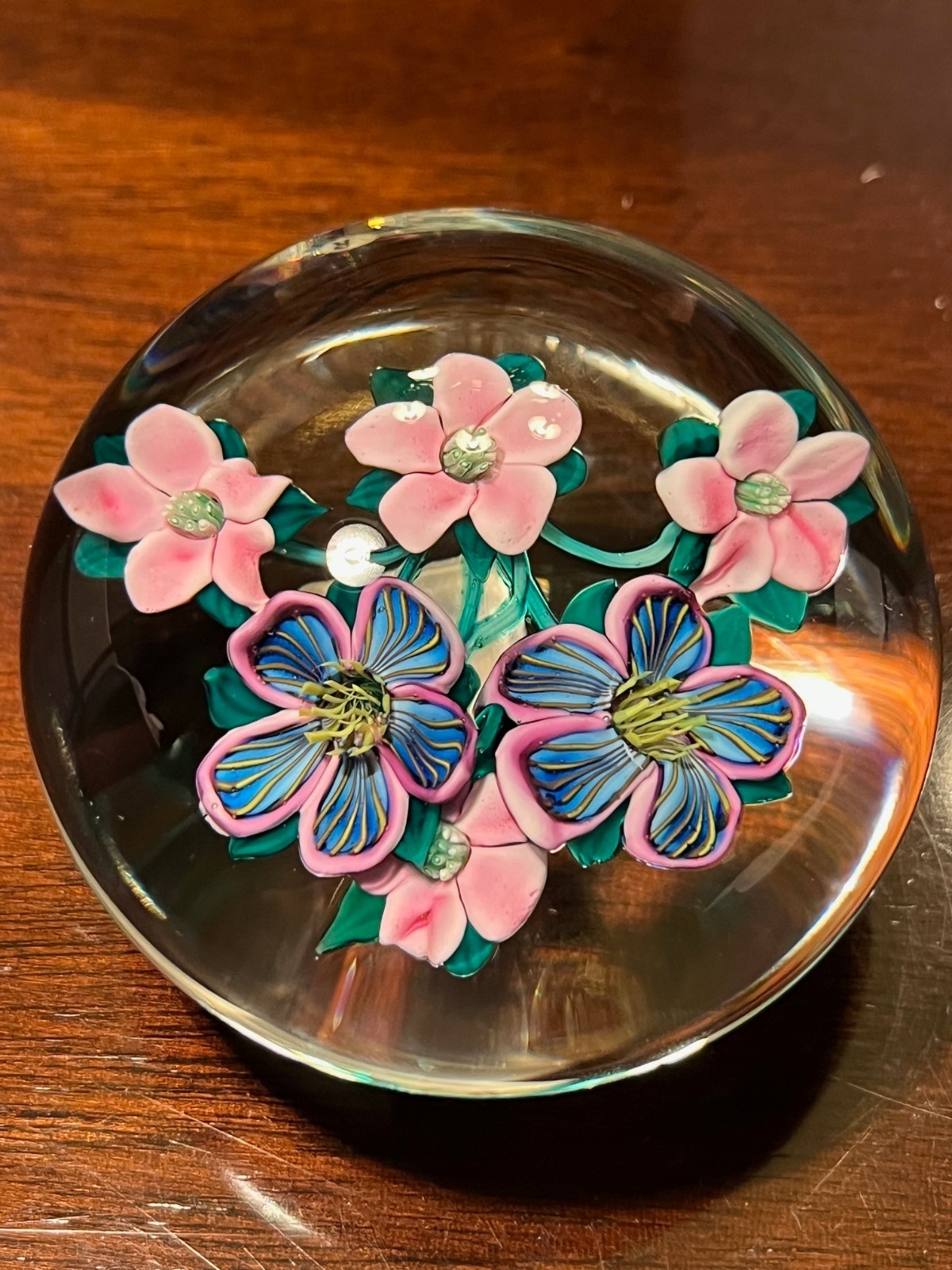 Early 1985 Ken Rosenfeld lampwork glass paperweight, pink and blue blossoms.