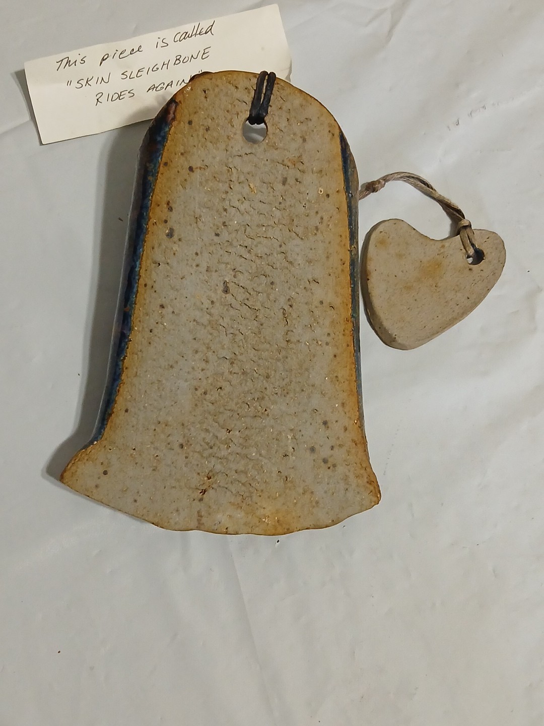 Art Pottery Wall Pocket W/attached Heart Called “Skin Sleigh bone rides again.”