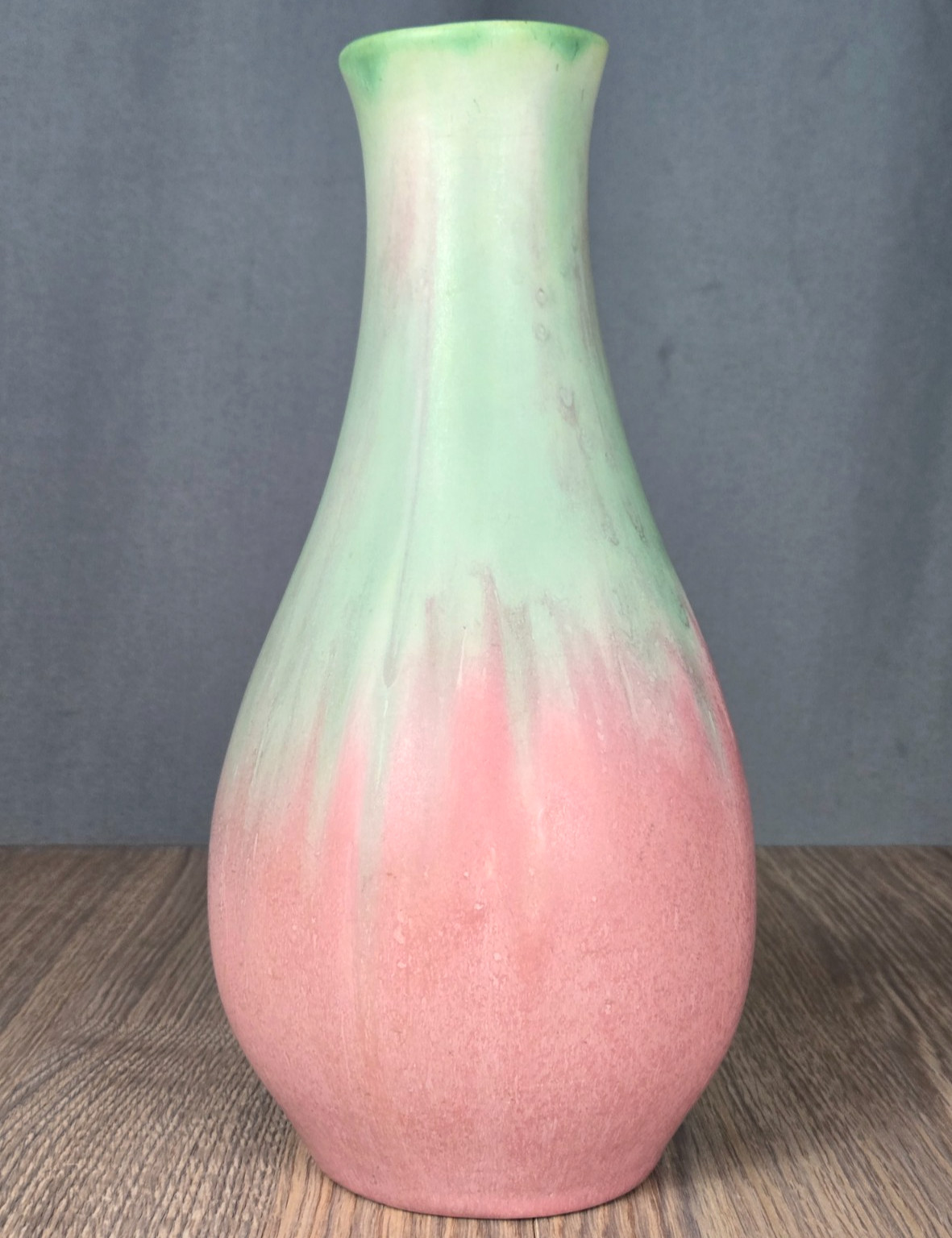 Muncie Pottery 11″ vase, shape #122, mauve and green, signed w edge chip
