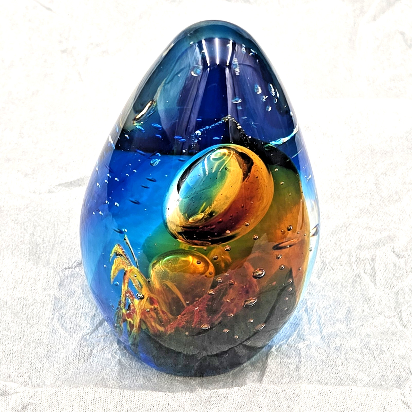 Glass Egg Shaped Paperweight Vtg Clear, Blue & Orange w/ bubble & sea grass 4.5″