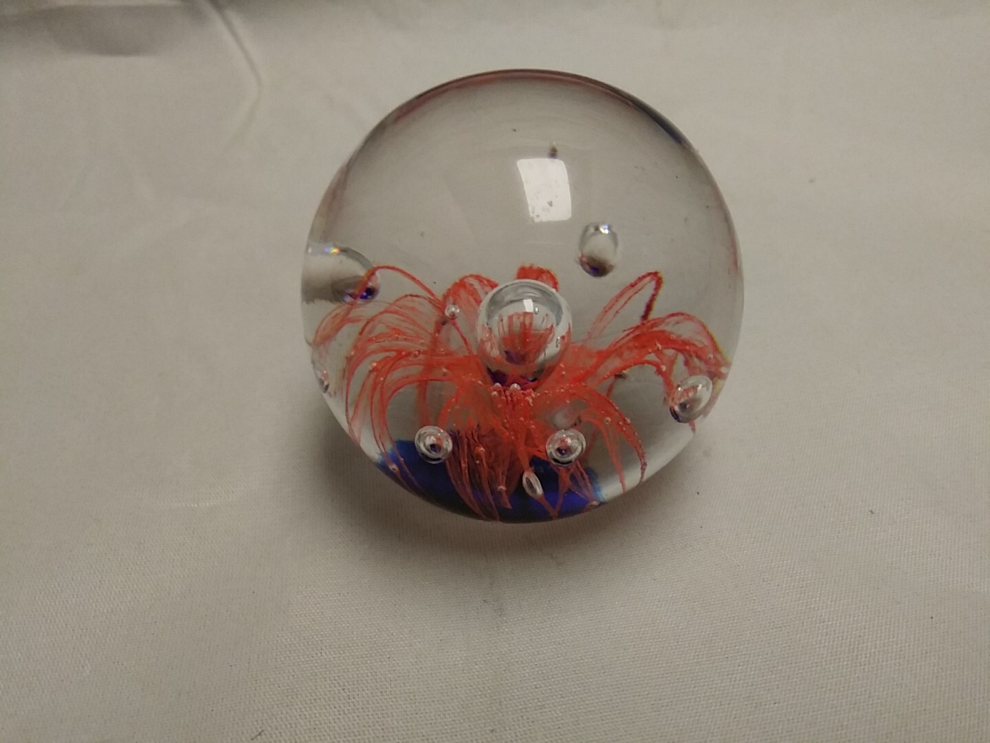 2.5″ Round Glass Orange W/Bubbles Firework Paperweigh