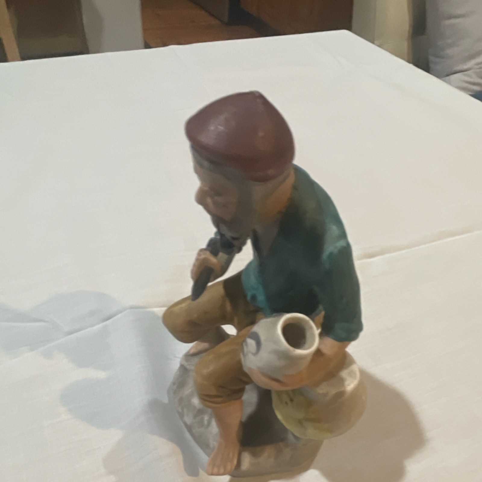Ceramic Multicolor Glossy Decorative Figurine of Man with Jug People Theme