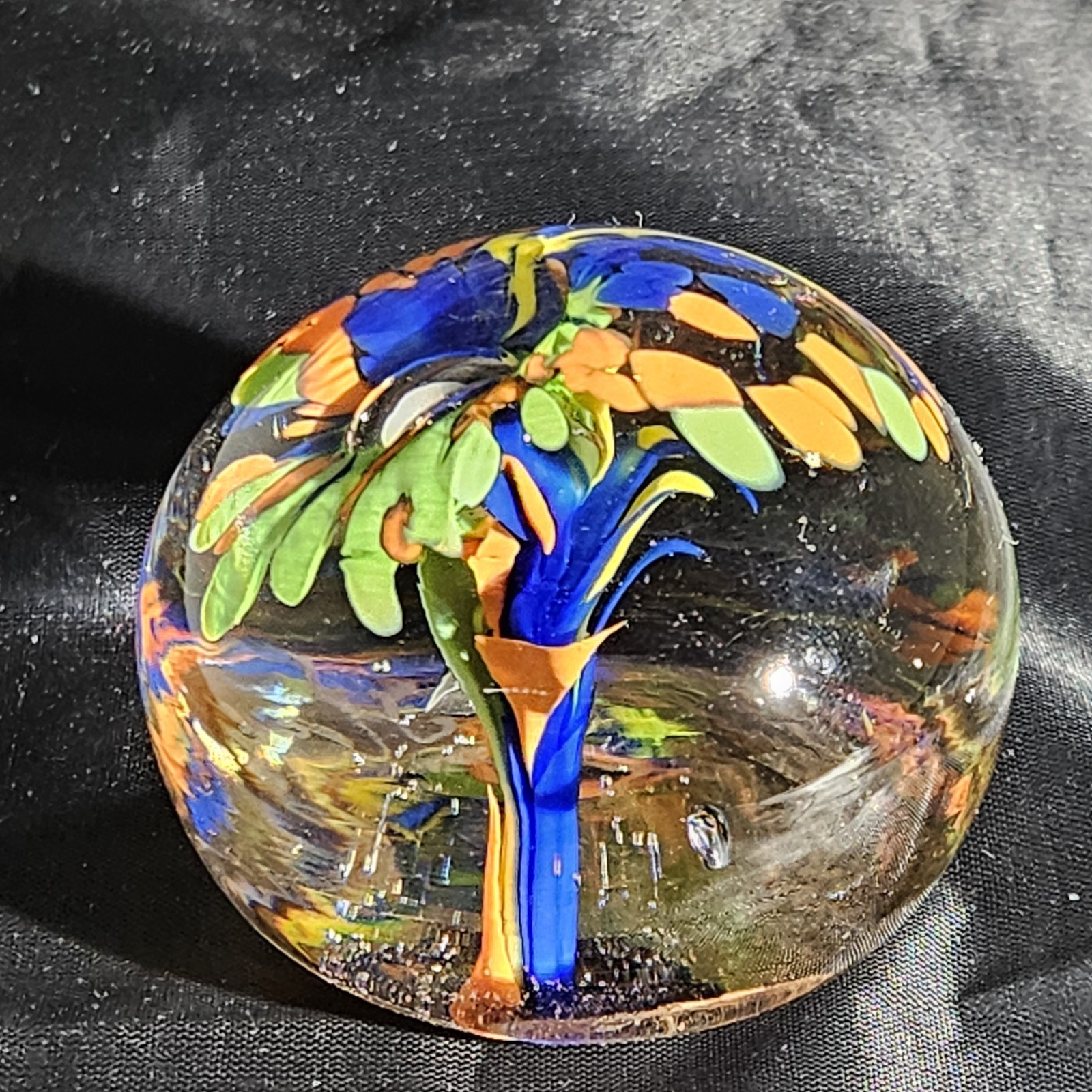 Signed Paperweight With Blue, Orange, And Green Flower with Controlled Bubble