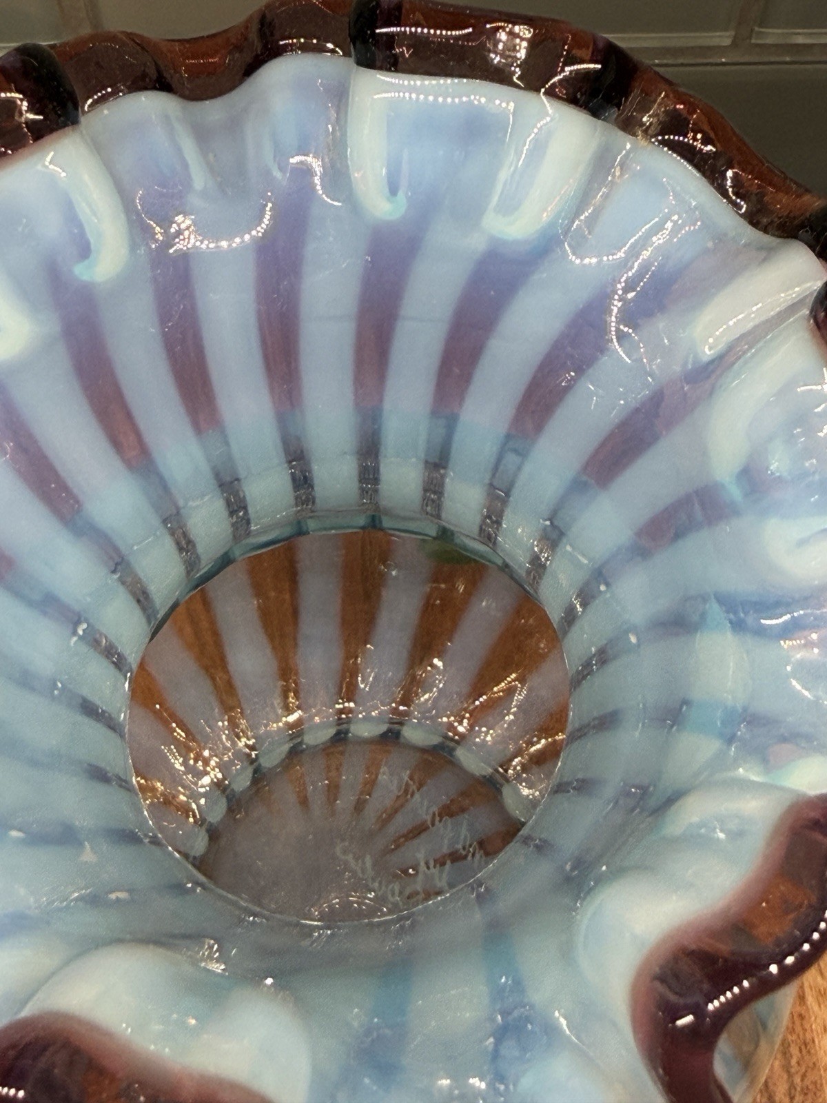 Fenton Art Glass “Misty Blue Rib Optic Vase” ruffled plum/mulberry edge (glows)