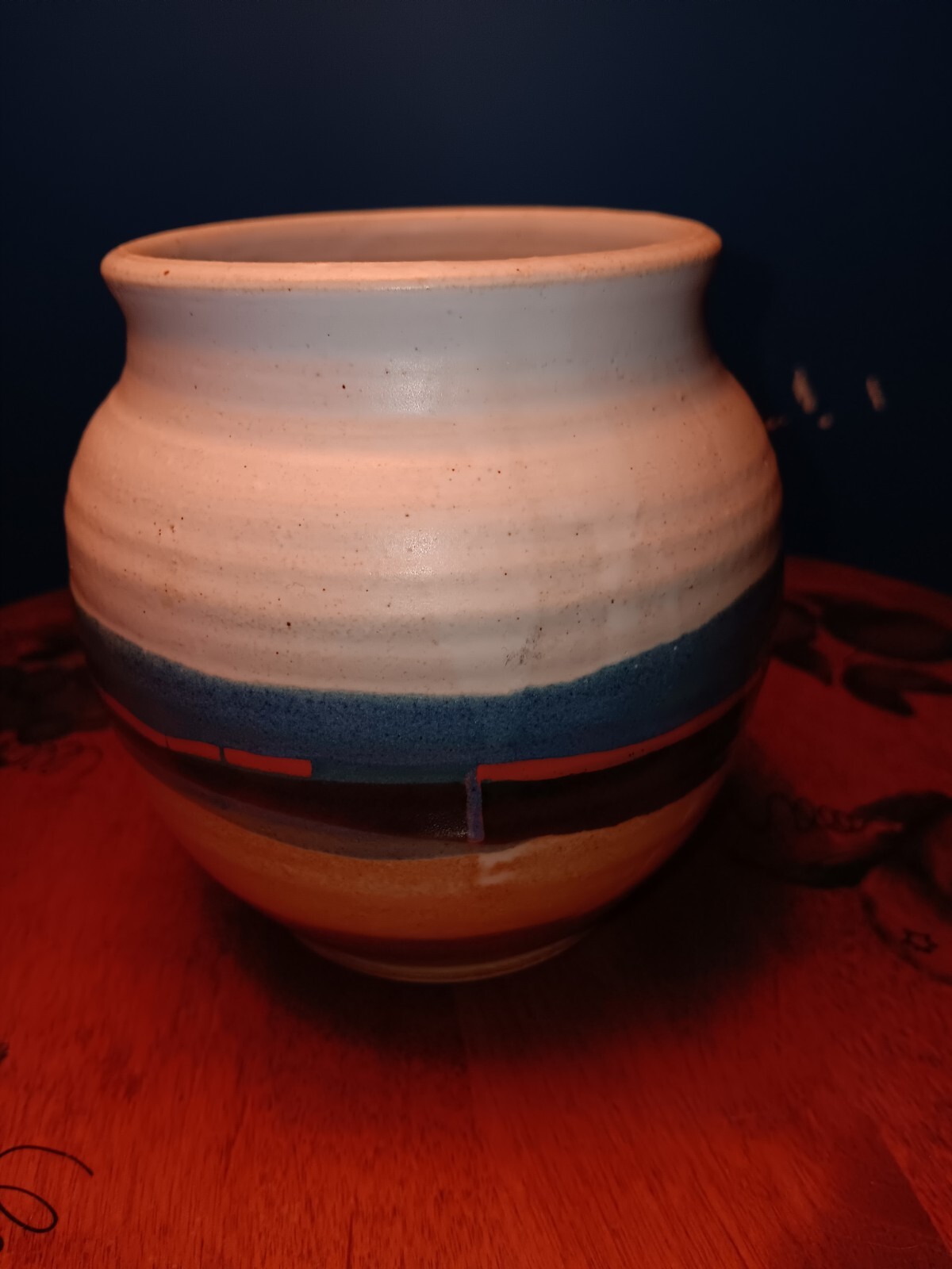 Pottery Artist Signed Blue. White blue red black tan brown, Round the vase.