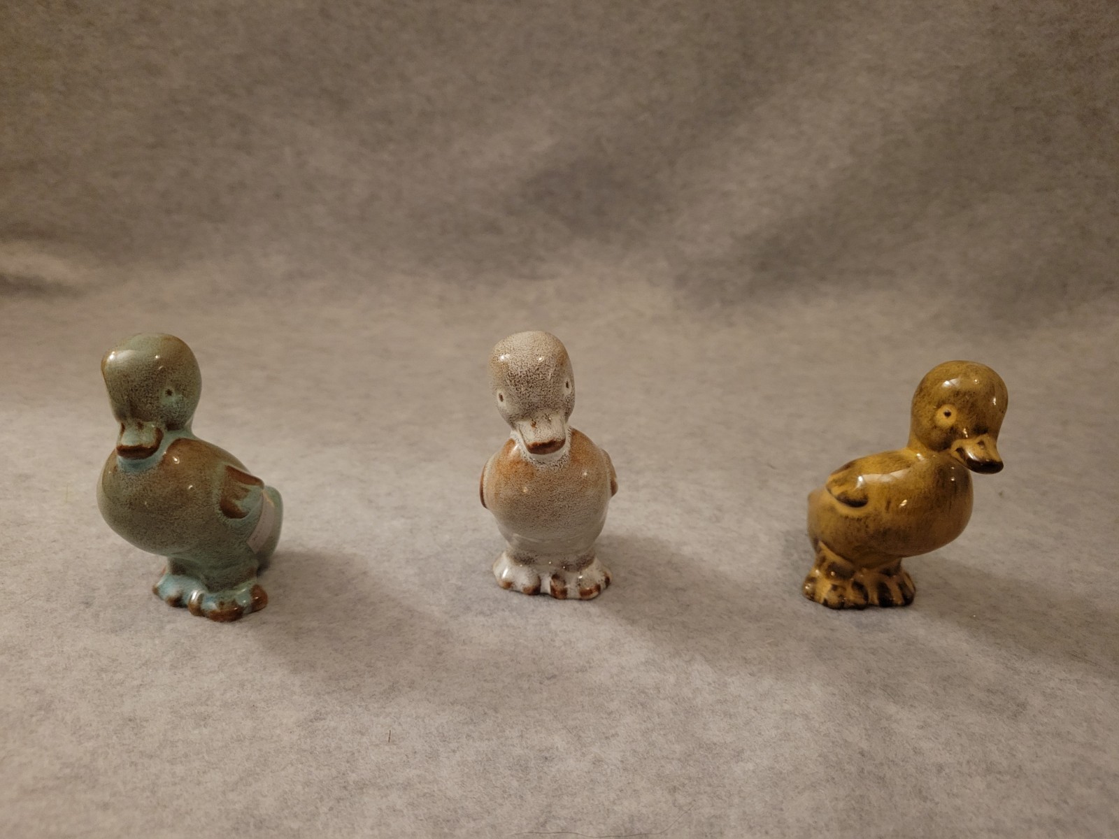Nicodemus Art Pottery three (3) ferro stone varied color Walking Ducks