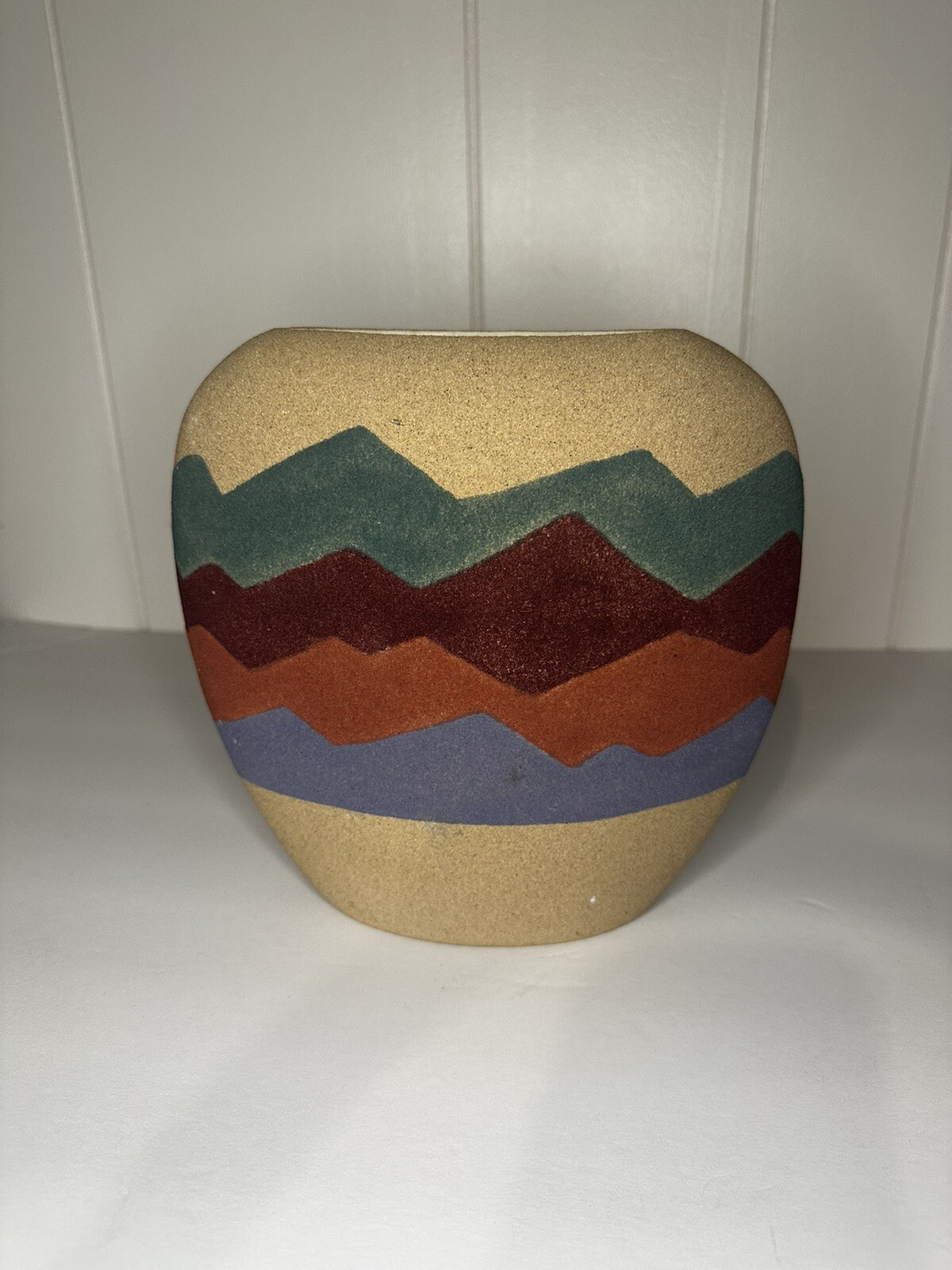 Two southwestern sand vases on large and one medium size
