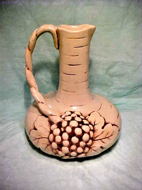 VINTAGE RUM RILL 616 L EWER GRAPES ON FRONT AND HANDLE IS ON LEFT LIGHTER COLOR