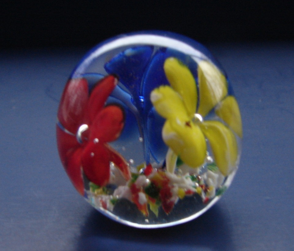 Small Blown Art Glass Paperweight With Red Yellow And Blue Flowers