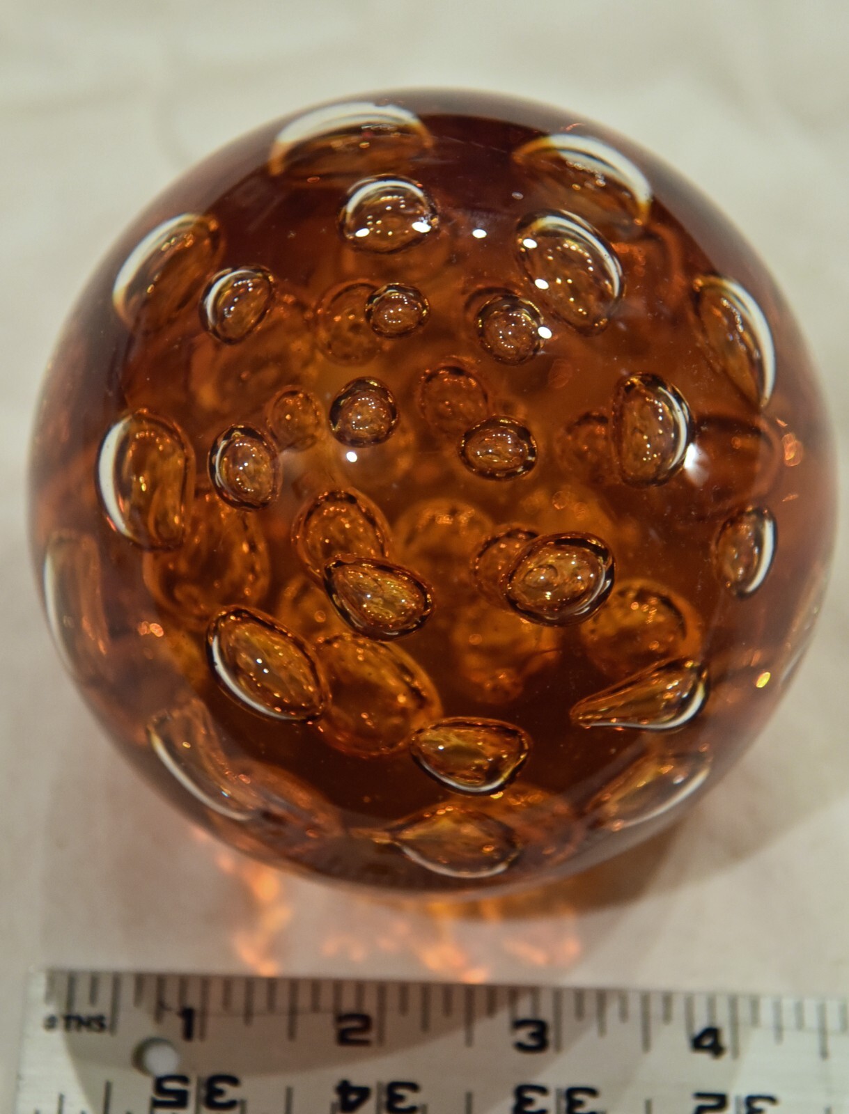 3 1/4″ high Amber Controlled Bobblues paperweight, weighs 4.6 pounds