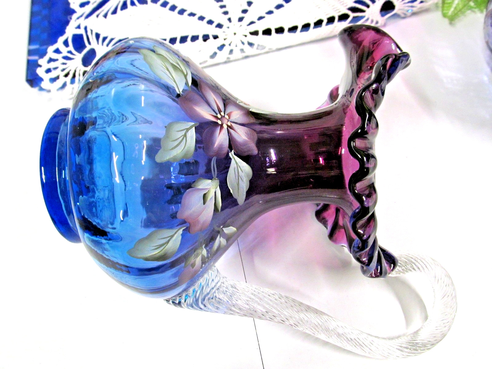 Fenton Art Glass pitcher in the “Mulberry” painted ladybug & flowers 355/1250