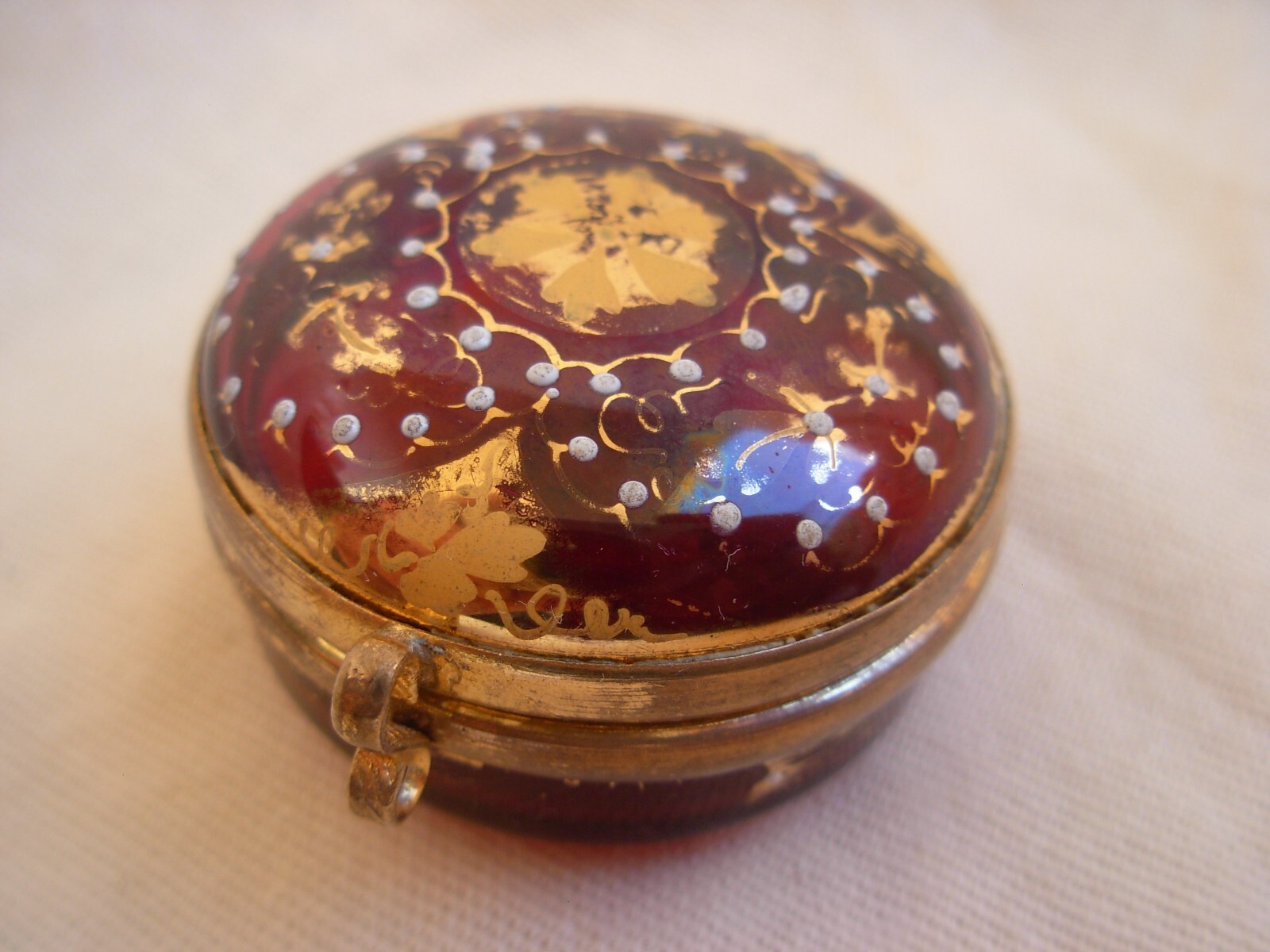ANTIQUE BOHEMIAN ENAMELED RED GLASS PILL BOX WITH GILT BRASS MOUNT,LATE 19th.
