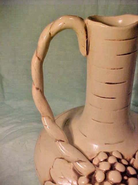 VINTAGE RUM RILL 616 L EWER GRAPES ON FRONT AND HANDLE IS ON LEFT LIGHTER COLOR