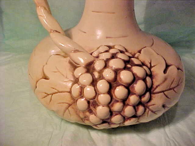 VINTAGE RUM RILL 616 L EWER GRAPES ON FRONT AND HANDLE IS ON LEFT LIGHTER COLOR
