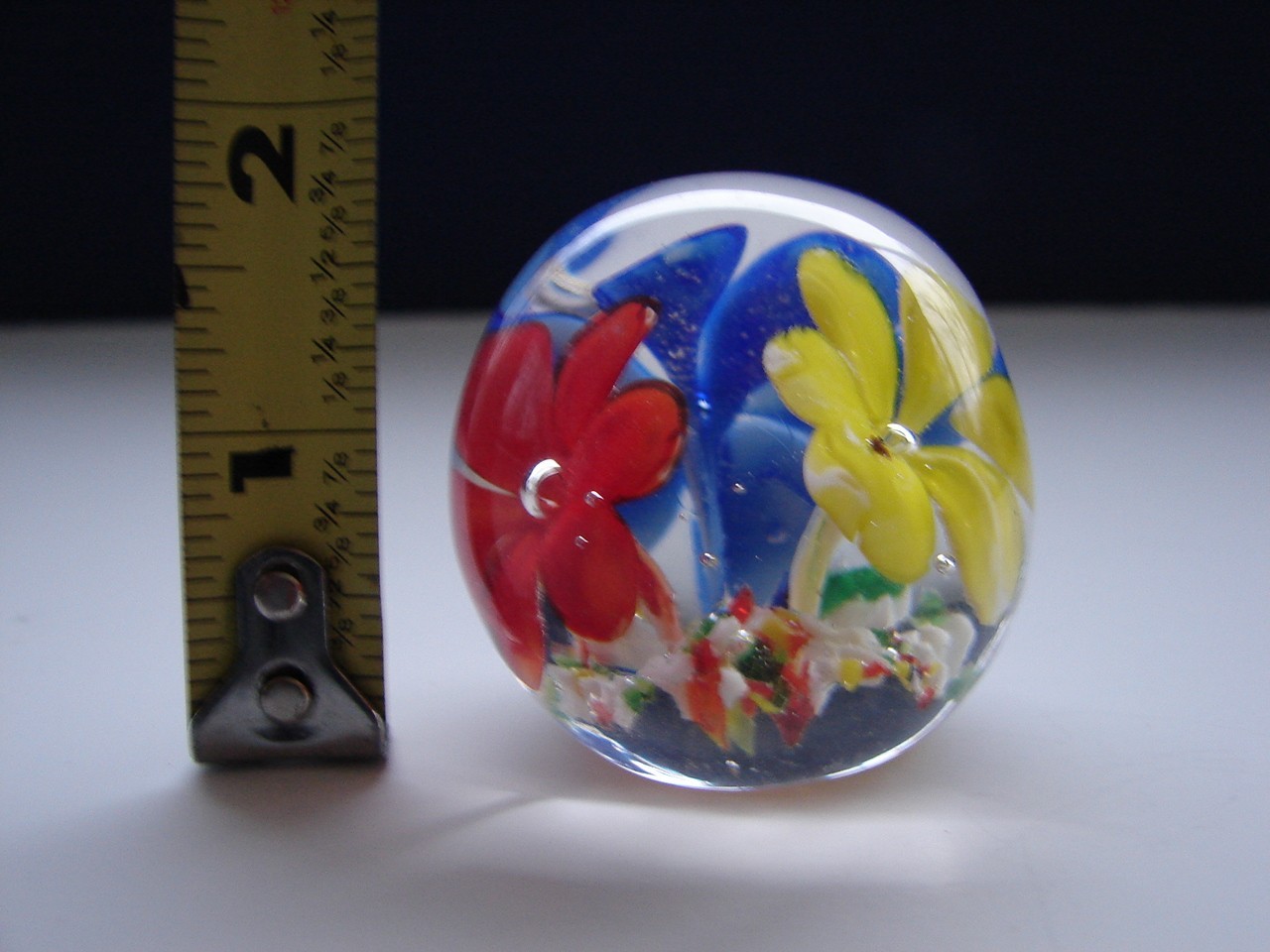 Small Blown Art Glass Paperweight With Red Yellow And Blue Flowers