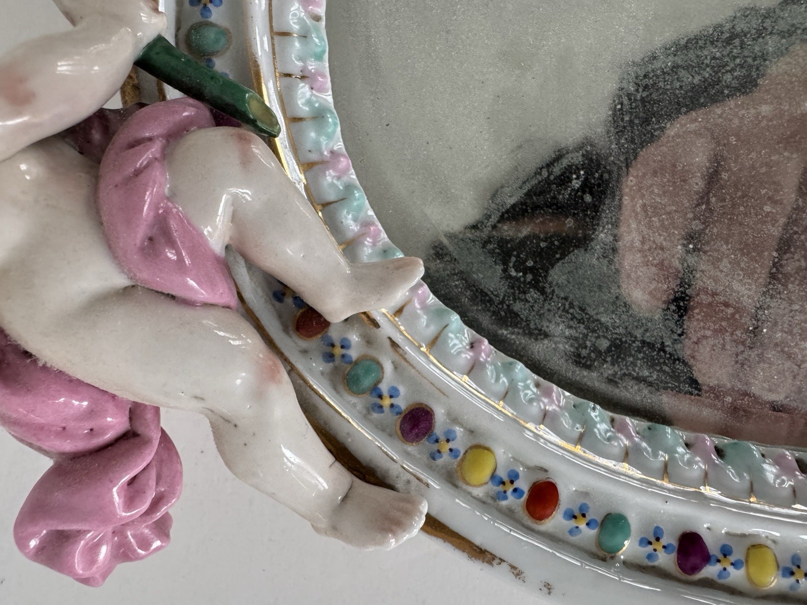 Antique Meissen porcelain mirror with original glass. Decorated with putti.
