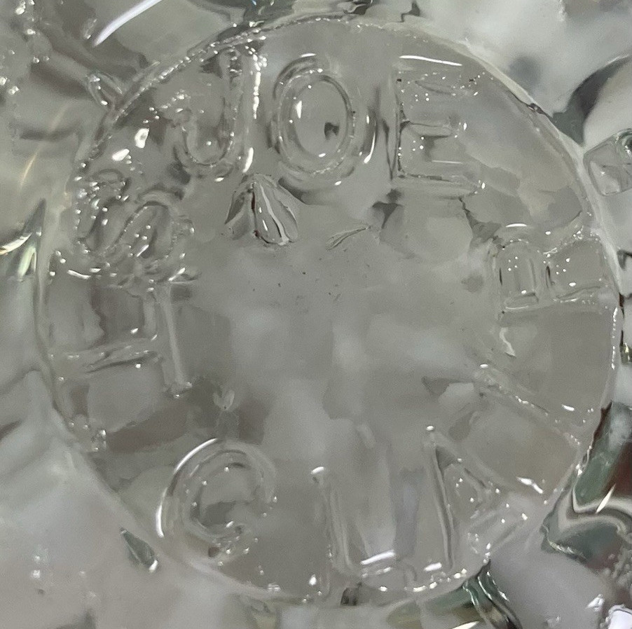 Joe St. Clair Clear Egg Shape Paperweight White Trumpet Flower, w/ Bubbles
