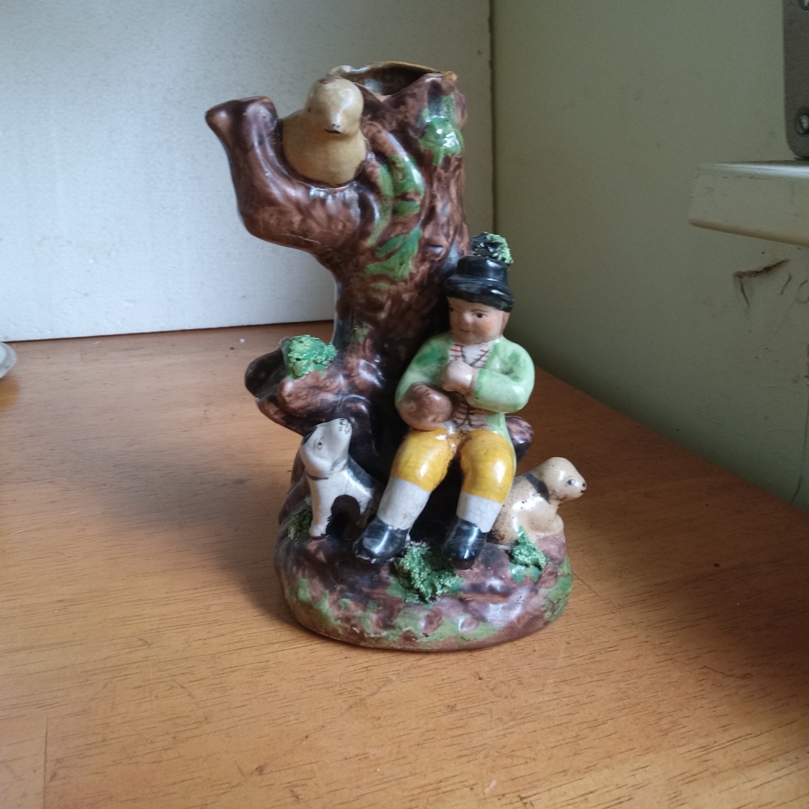 ANTIQUE POTTERY SPILL VASE MAN WITH TWO DOGS & BIRD PERCHED ON TREE