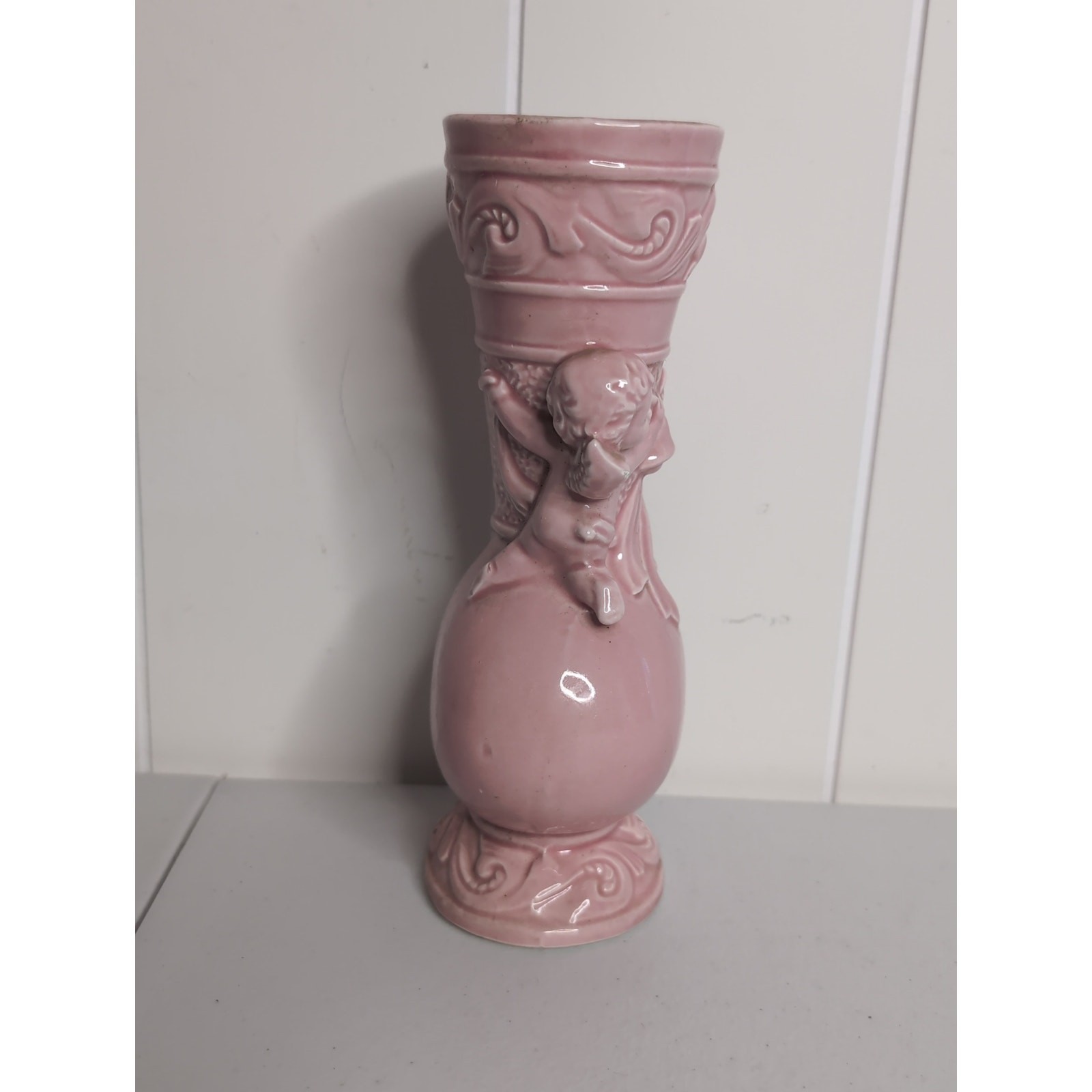 Vintage Norleans made in Japan pink ceramic vase with angels holding a bell.
