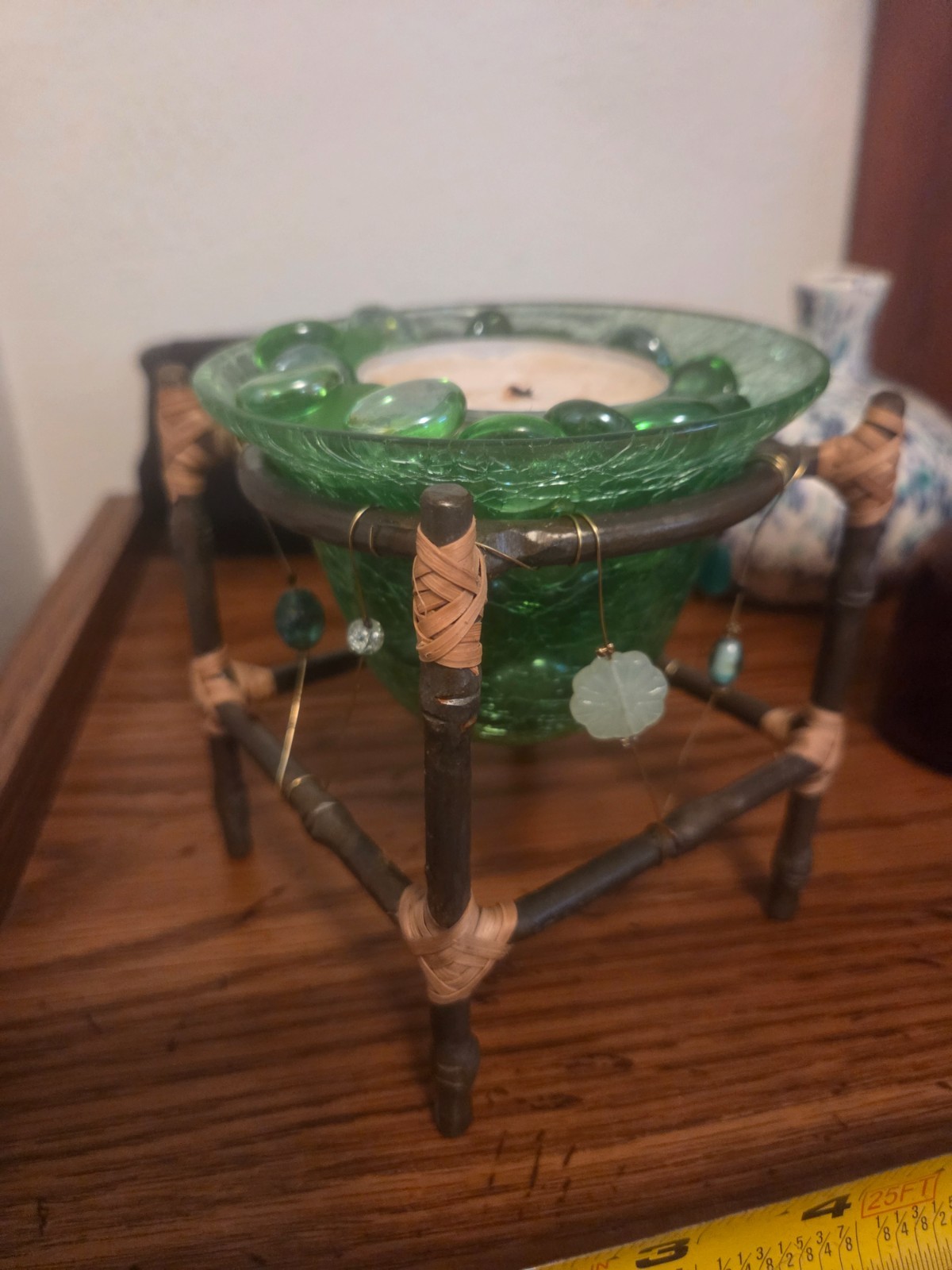 Handmade green beaded art dish, candle, decorative stones.