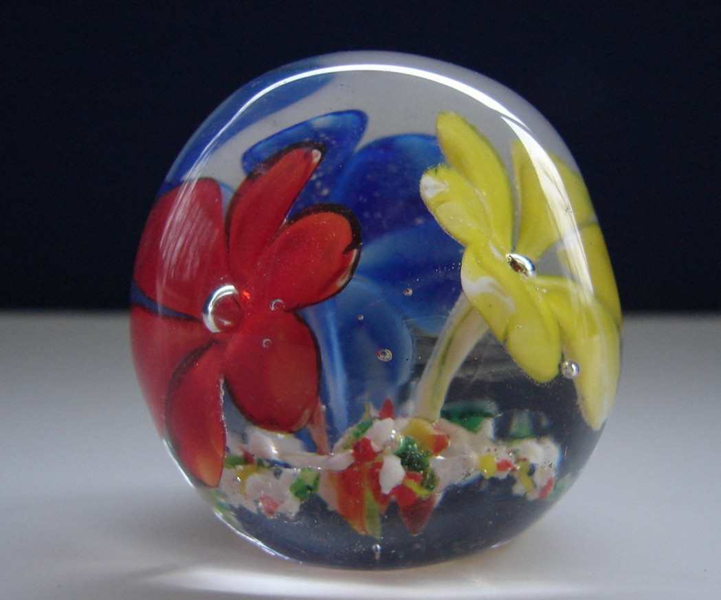 Small Blown Art Glass Paperweight With Red Yellow And Blue Flowers