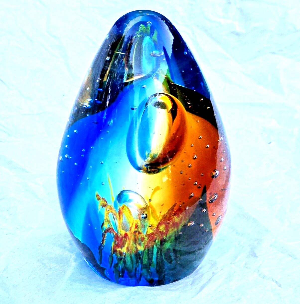 Glass Egg Shaped Paperweight Vtg Clear, Blue & Orange w/ bubble & sea grass 4.5″