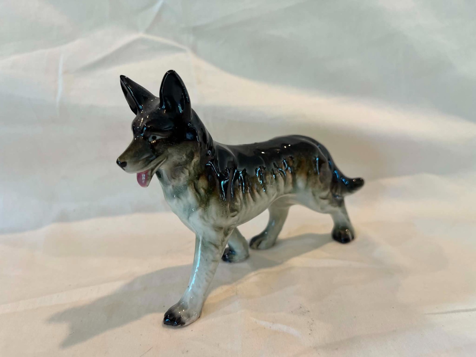 Porcelain German Sheperd Dog figurine not marked 5X4″
