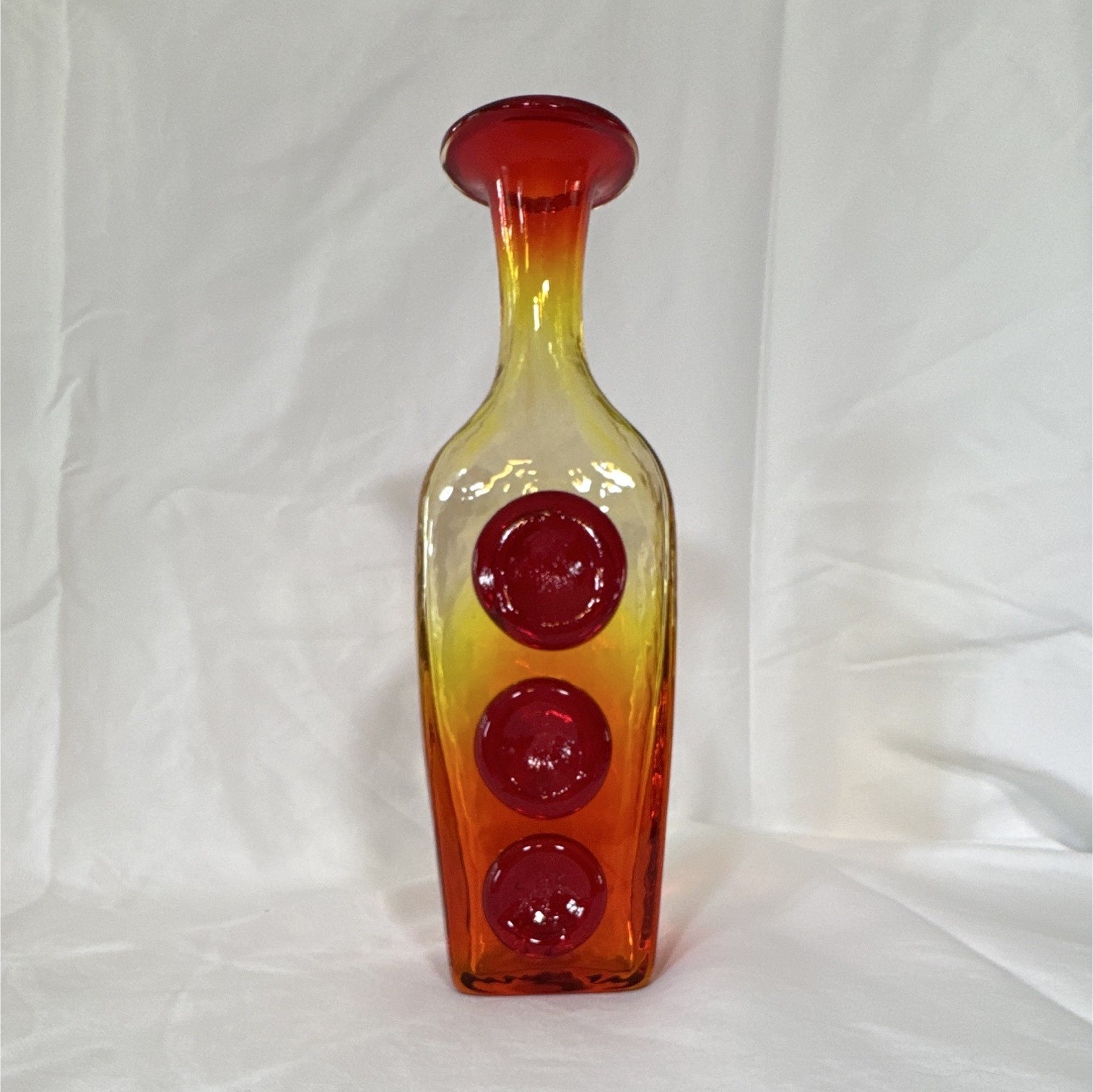 Amberina glass bottle vase produced by the Rainbow Art Glass Company