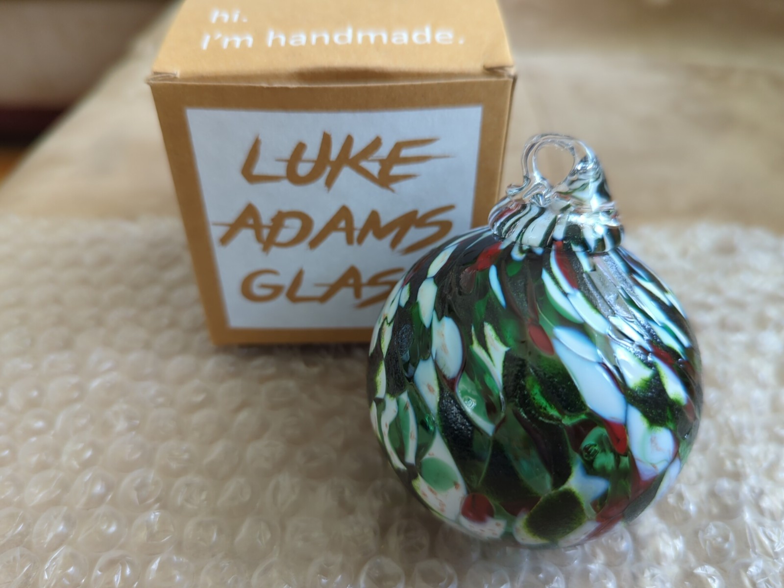 Luke Adams Hand Blown Glass Ornament Orb Multi Color on Green Christmas Decor