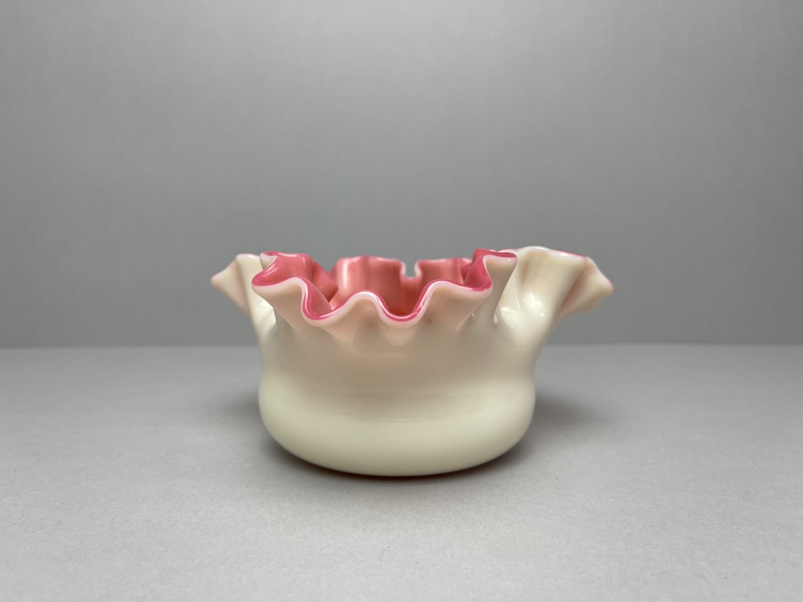 Antique Victorian Stourbridge Custard glass with a pink interior ruffled bowl