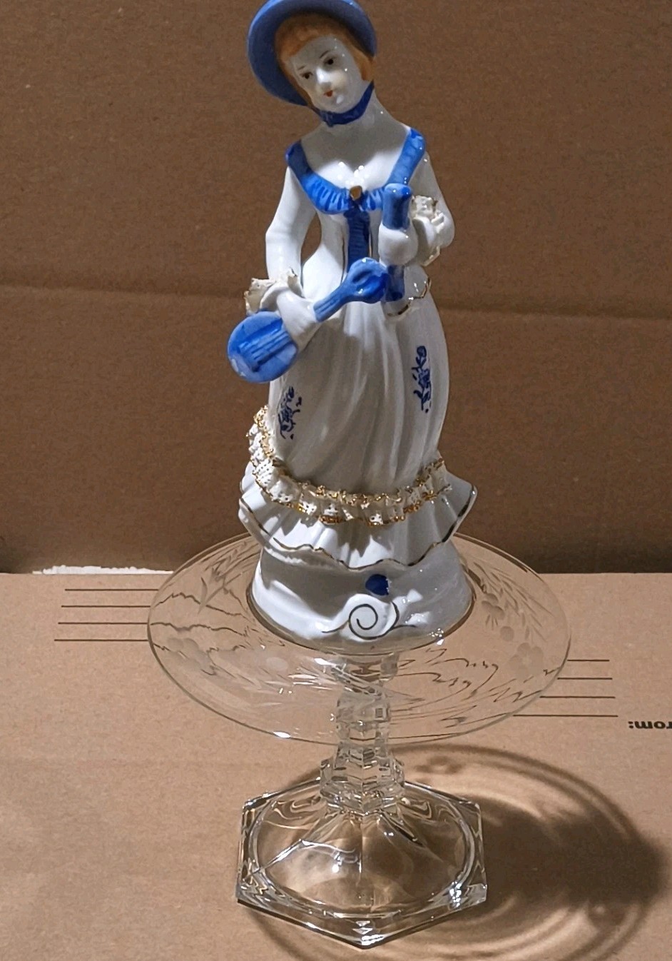 White Blue Gold Ceramic Woman Figurine on Glass Pedestal Stand