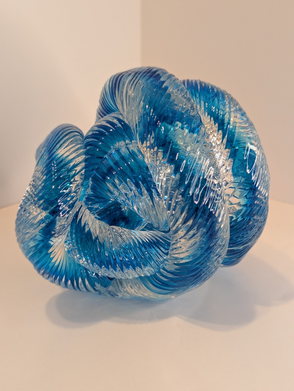 Clear and Blue Ribbed Art Glass Infinity Rope Twisted Knot Paperweight