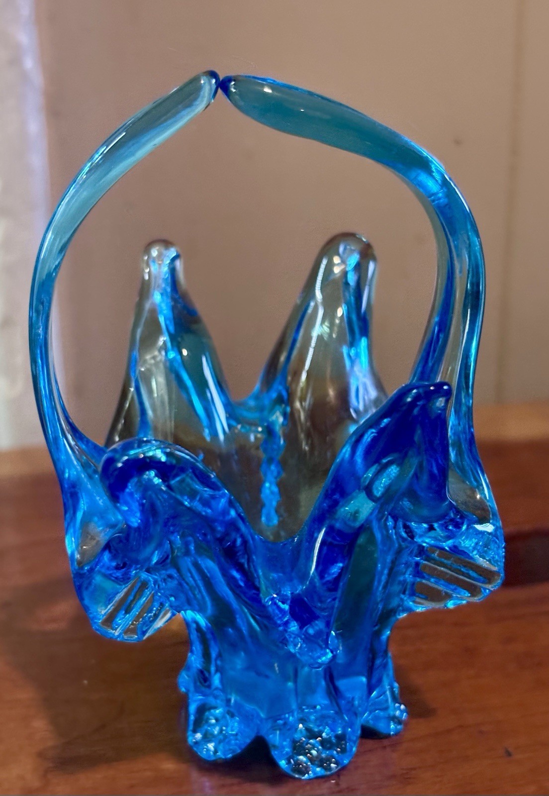 small vintage blue Chalet glass basket featuring a distinctive split handle