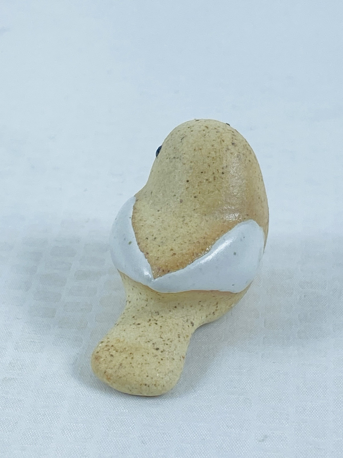 Mini 1.5” Long Speckled Peach Pottery Bird With White Glossy Wings Figurine