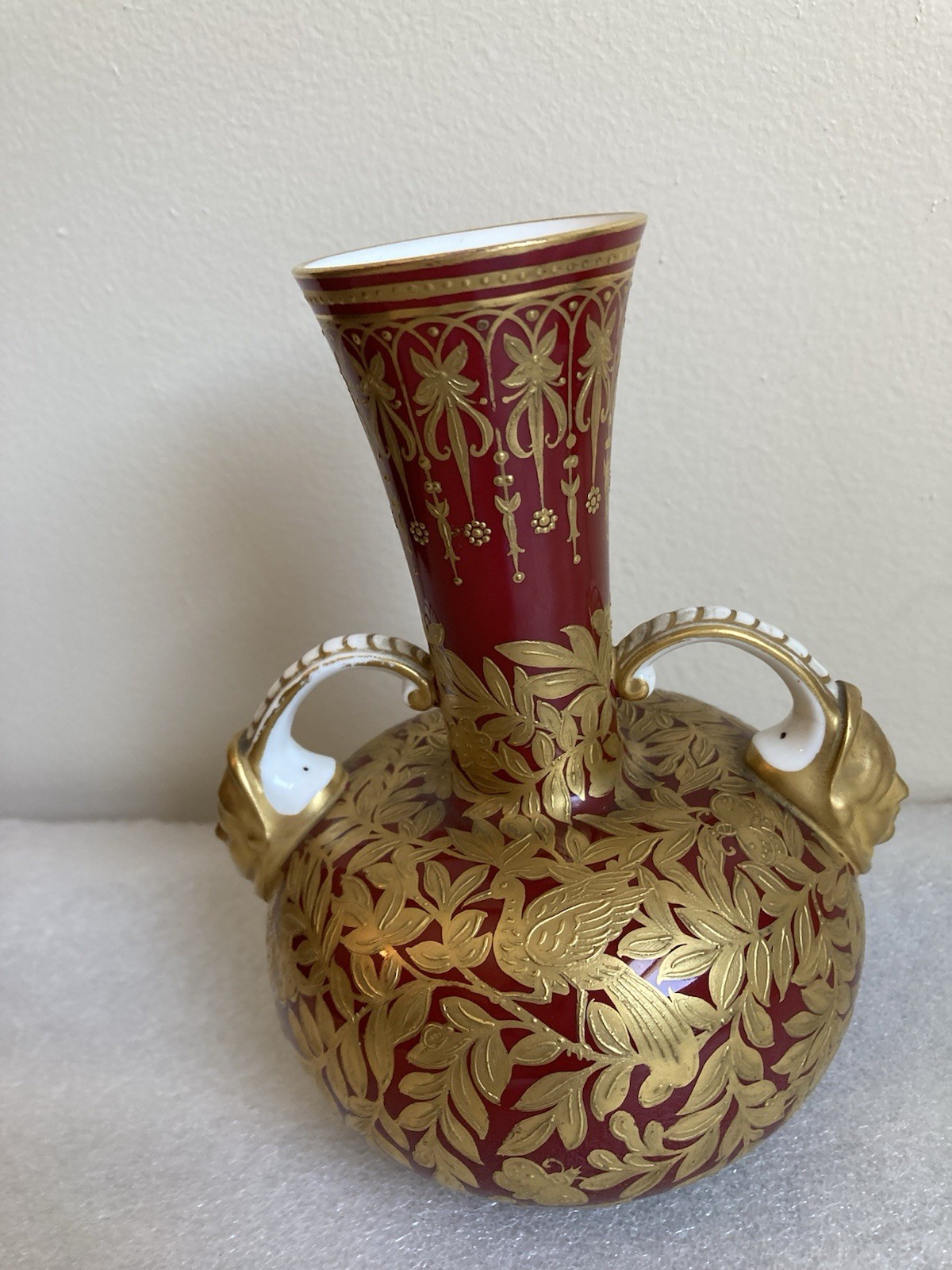 Royal Crown Derby 6″ Vase Sang de Boeuf Glaze Gilt Foliage Birds w Mask Handles