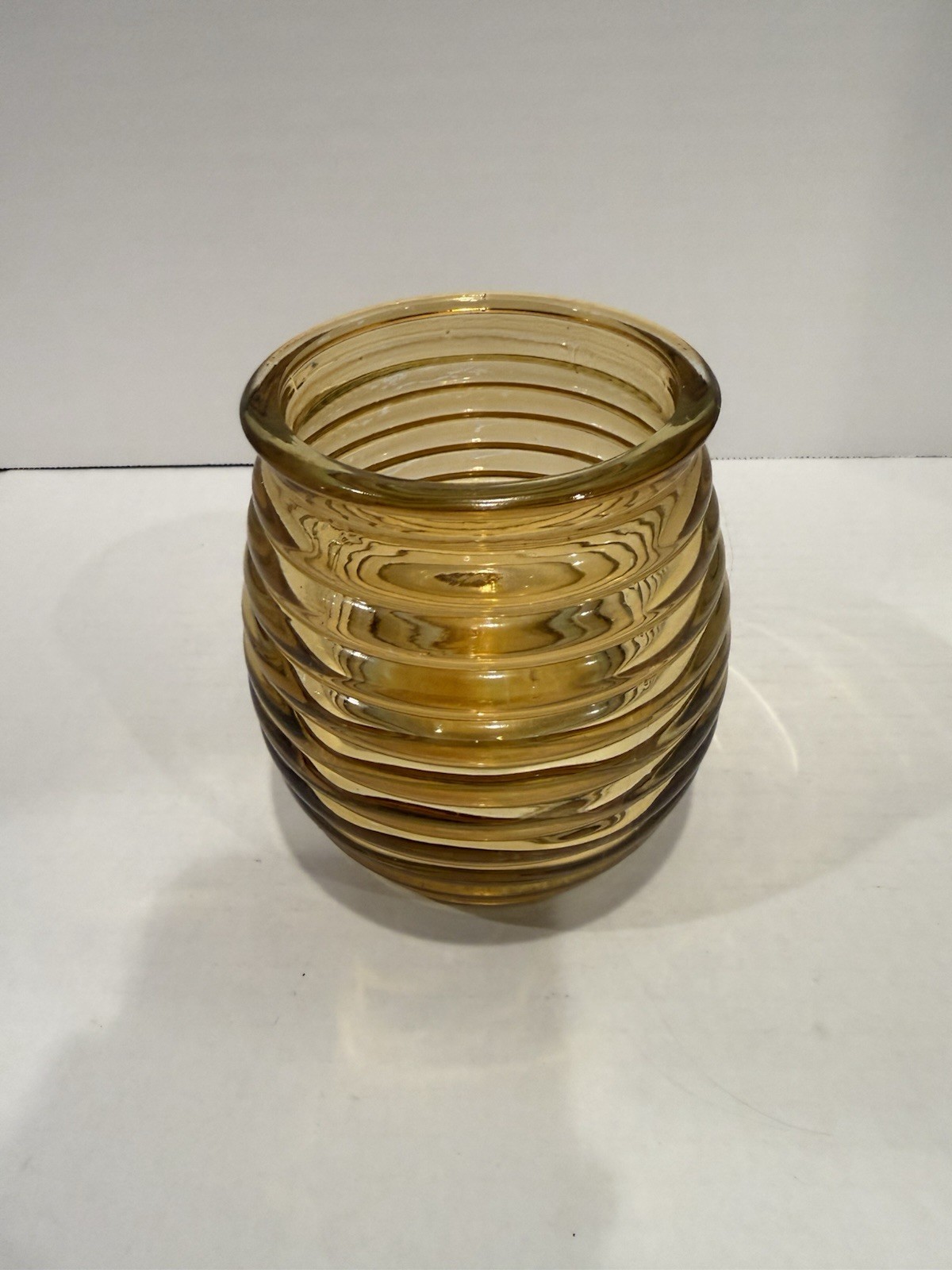 Dartington Amber Crystal Beehive Vase featuring a distinct ribbed swirled design
