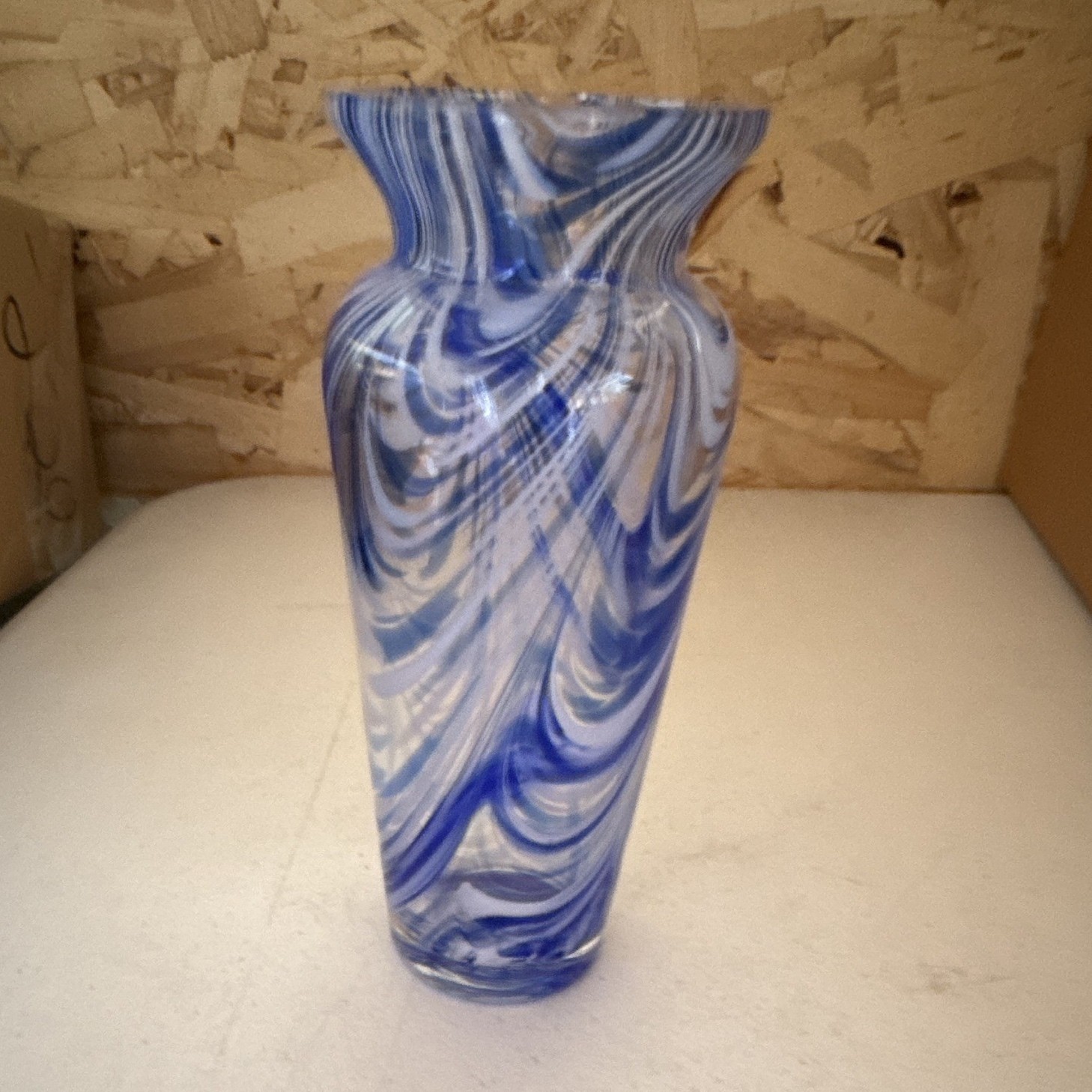 This is a vintage blue and white swirl crystal vase from Royal Limited