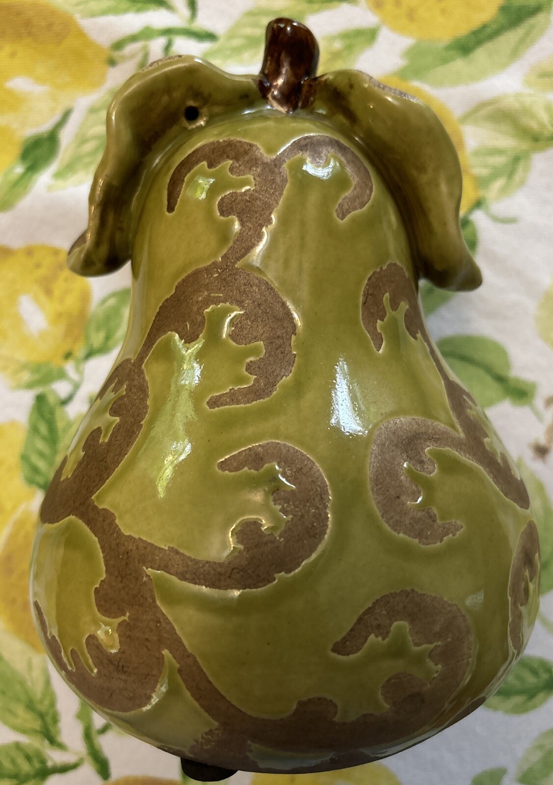 Handmade ceramic pear- 6 1/2 Inches Tall. Glossy Green With Brown Relief.