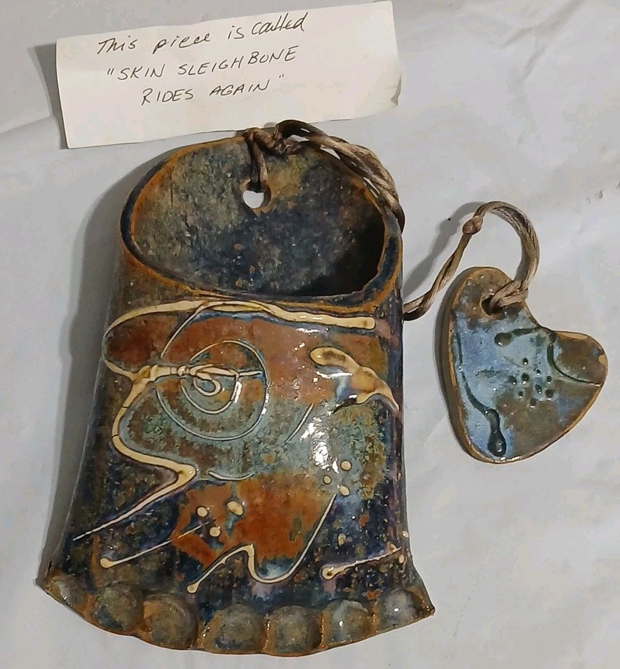 Art Pottery Wall Pocket W/attached Heart Called “Skin Sleigh bone rides again.”