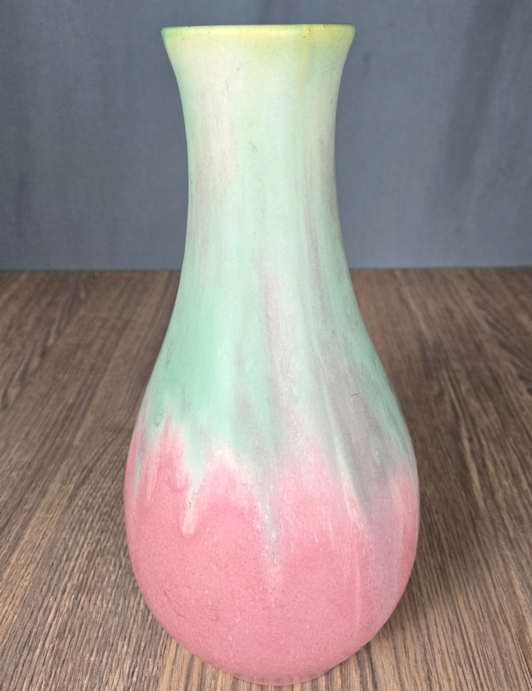 Muncie Pottery 11″ vase, shape #122, mauve and green, signed w edge chip